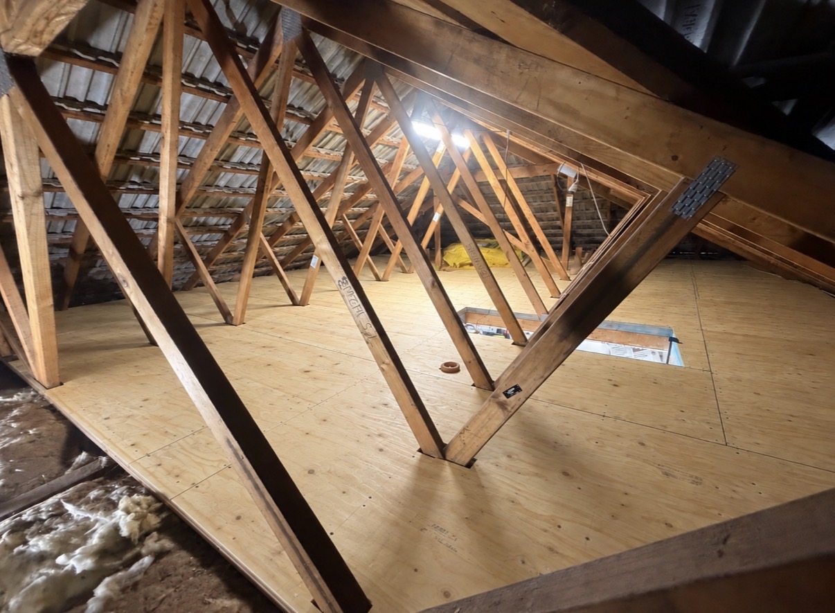 Roof space after: structural plywood floor laid over the bearers